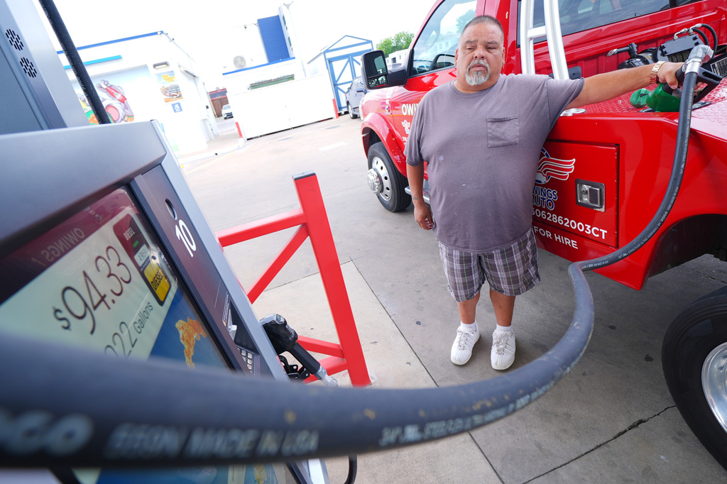 A ticker shows diesel gas charges as James Navarro fuels his tow truck Friday, May 15, 2026, in Arlington, Texas. (AP Photo/Julio Cortez)