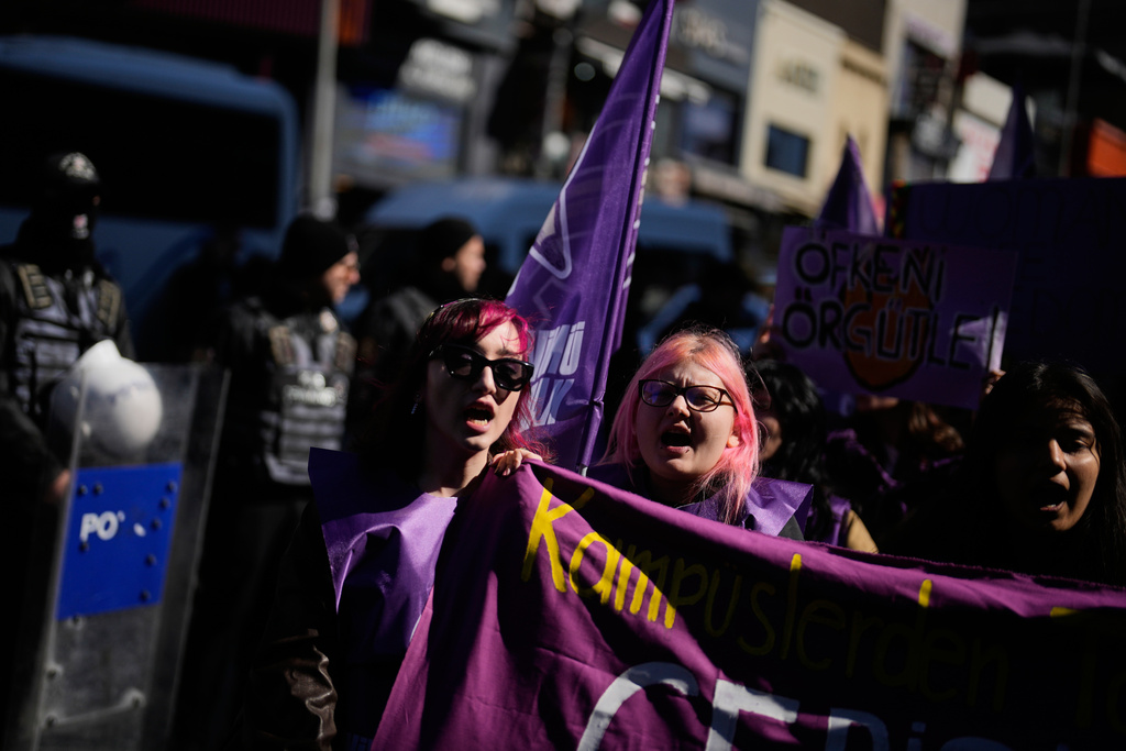 Women shout slogans as they march during a protest marking the International Women's Day, in Istanbul, Turkey, Sunday, March 8, 2026. (AP Photo/Khalil Hamra)