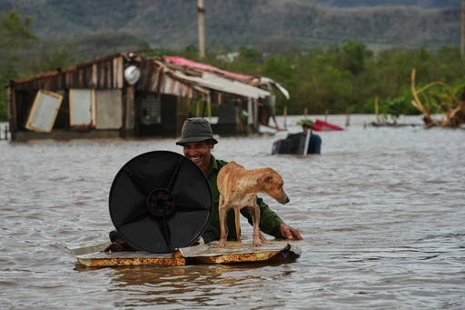 A man wades through floodwaters with his dog and belongings from his home flooded by Hurricane Melissa in Santiago de Cuba, Wednesday, Oct. 29, 2025. (AP Photo/Ramón Espinosa) A man wades through floodwaters with his dog and belongings from his home flooded by Hurricane Melissa in Santiago de Cuba, Wednesday, Oct. 29, 2025. (AP Photo/Ramón Espinosa)