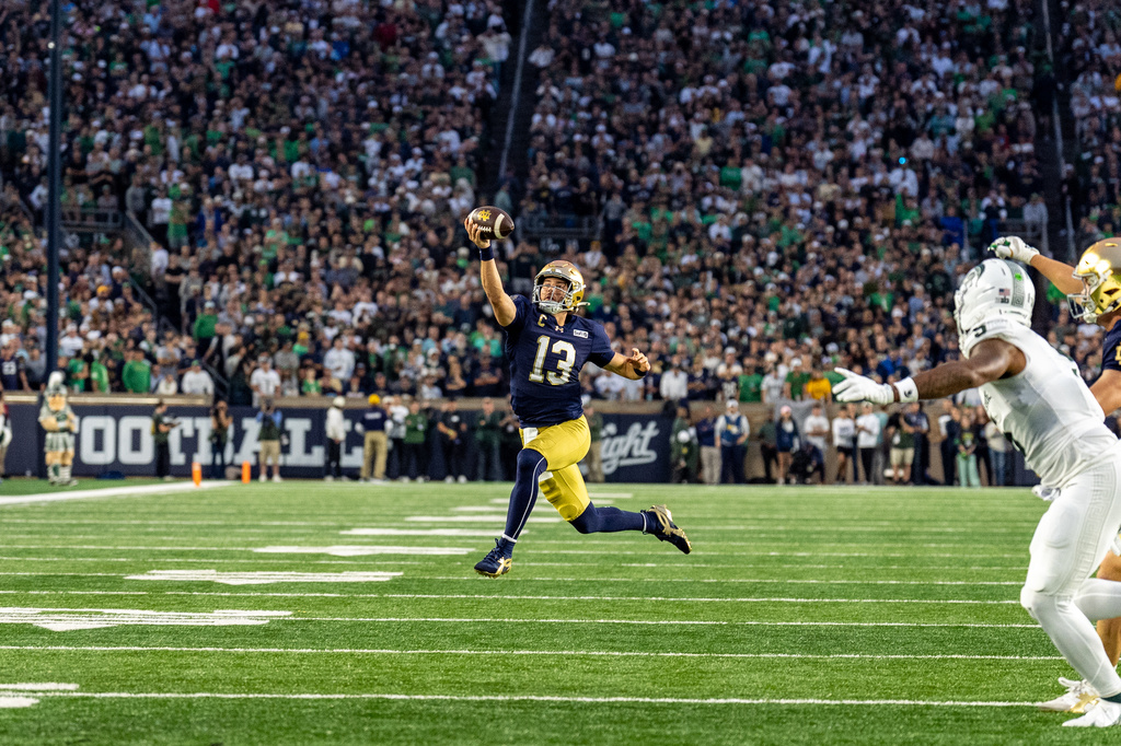 Notre Dame quarterback CJ Carr (13) pump fakes during the first half of a college football game against Michigan State, Saturday, Sept. 19, 2026, in South Bend, Ind. (AP Photo/Paul Barnick)