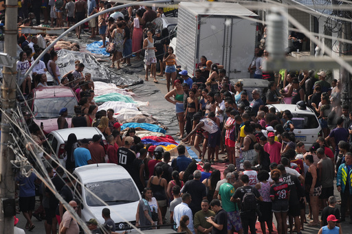 Residents look at the bodies of people killed the day before during a police raid targeting the Comando Vermelho gang in the Complexo da Penha favela of Rio de Janeiro, Brazil, Wednesday, Oct. 29, 2025. (AP Photo/Silvia Izquierdo) Residents look at the bodies of people killed the day before during a police raid targeting the Comando Vermelho gang in the Complexo da Penha favela of Rio de Janeiro, Brazil, Wednesday, Oct. 29, 2025. (AP Photo/Silvia Izquierdo)