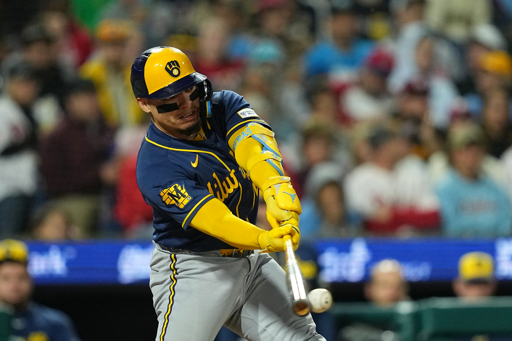Milwaukee Brewers' William Contreras hits a two-run single off of Philadelphia Phillies pitcher Aaron Nola during the third inning of a baseball game, Wednesday, Sept. 23, 2026, in Philadelphia. (AP Photo/Matt Rourke)