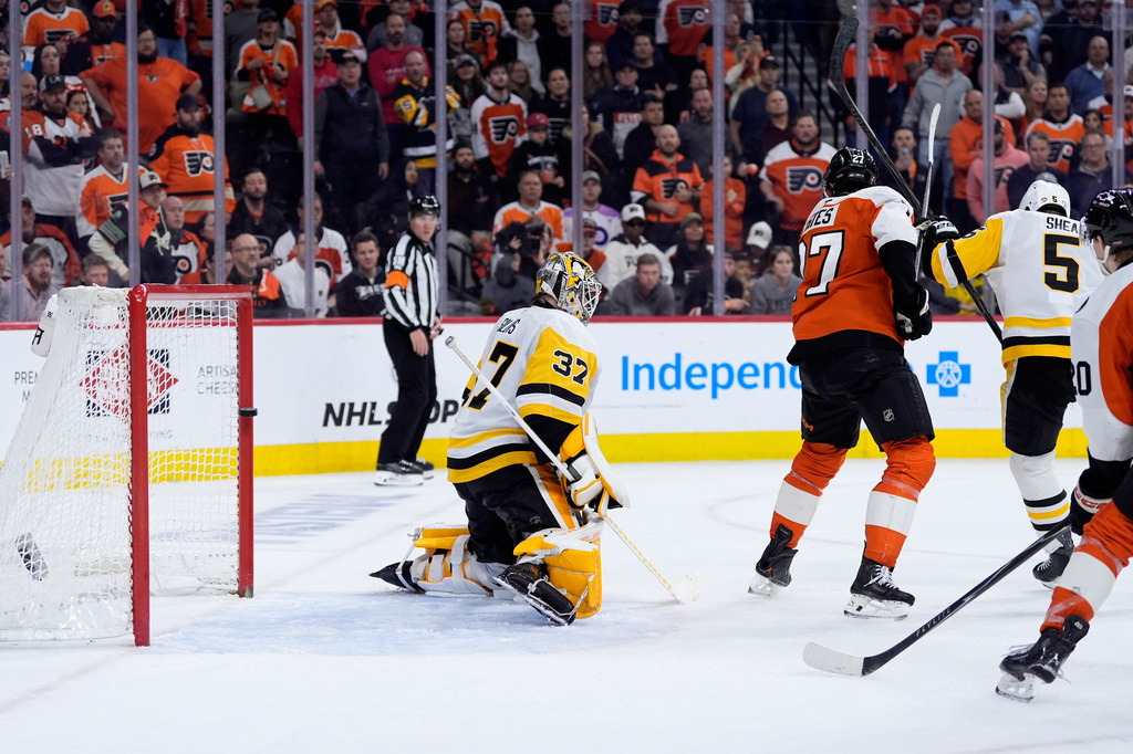 Pittsburgh Penguins' Arturs Silovs (37) cannot stop the game-winning goal by Philadelphia Flyers' Cam York during overtime in Game 6 in the first round of the NHL hockey Stanley Cup playoffs series Wednesday, April 29, 2026, in Philadelphia. (AP Photo/Matt Slocum)