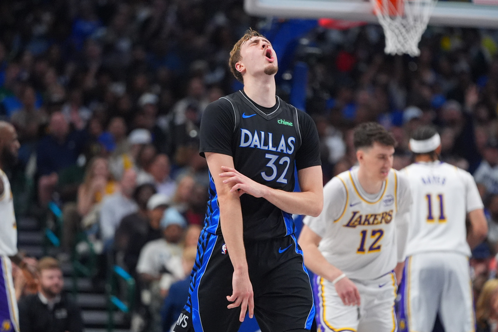 Dallas Mavericks forward Cooper Flagg (32) reacts to a score during the first half of an NBA basketball game against the Los Angeles Lakers in Dallas, Sunday, April 5, 2026. (AP Photo/LM Otero)