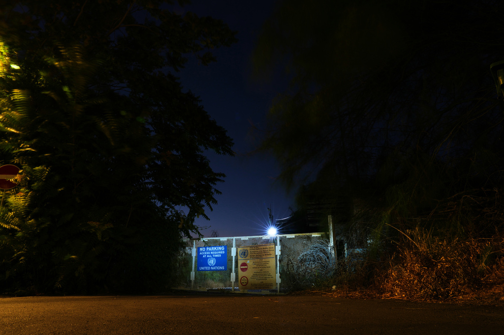 A gate used by U.N peacekeepers separates the Greek Cypriot south from the Turkish Cypriot north along the U.N.-controlled buffer zone, established after the July 20, 1974 Turkish invasion of Cyprus, in the medieval core of the divided capital, Nicosia, Cyprus, on July 14, 2026. (AP Photo/Petros Karadjias)