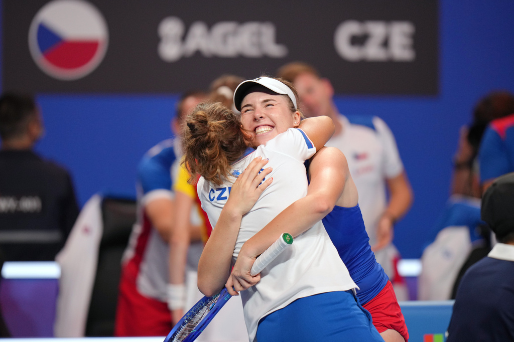 Czech Republic's Linda Noskova smiles and hugs a member of her team as they celebrate her victory against Spain's Cristina Bucsa in the Billie Jean King Cup women's singles semifinal between Spain and Czech Republic, in Shenzhen, China, Friday, Sept. 25, 2026. (AP Photo/Andy Wong)