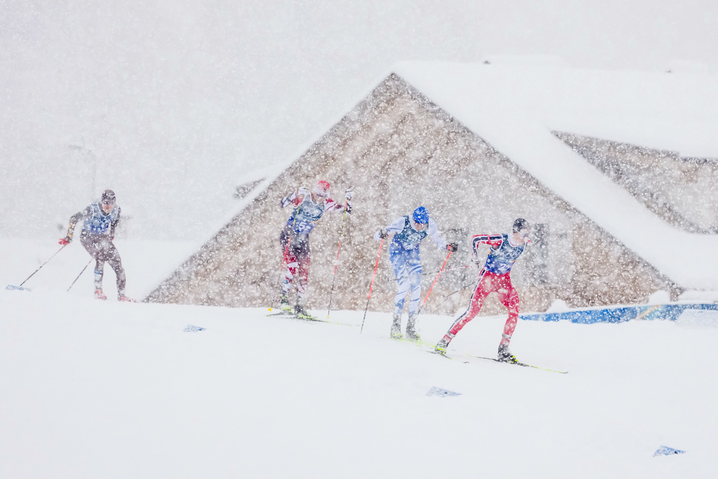 Jens Luraas Oftebro, of Norway, from right, Eero Hirvonen, of Finland and Johannes Lamparter, of Austria, compete in the nordic combined team sprint at the 2026 Winter Olympics, in Tesero, Italy, Thursday, Feb. 19, 2026. (AP Photo/Kirsty Wigglesworth)