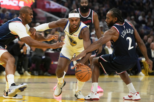 Golden State Warriors guard Buddy Hield, middle, reaches for the ball between Los Angeles Clippers guard Chris Paul, left, and forward Kawhi Leonard (2) during the first half of an NBA basketball game in San Francisco, Tuesday, Oct. 28, 2025. (AP Photo/Jeff Chiu) Golden State Warriors guard Buddy Hield, middle, reaches for the ball between Los Angeles Clippers guard Chris Paul, left, and forward Kawhi Leonard (2) during the first half of an NBA basketball game in San Francisco, Tuesday, Oct. 28, 2025. (AP Photo/Jeff Chiu)