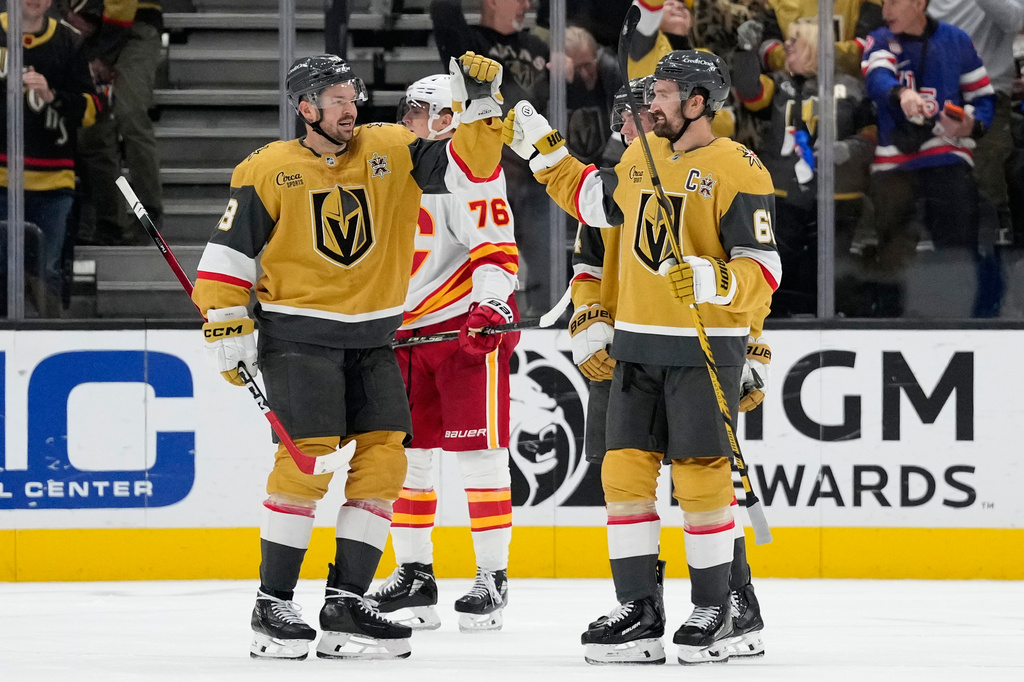 Vegas Golden Knights right wing Mark Stone (61) celebrates this third goal against the Calgary Flames during the third period of an NHL hockey game Thursday, Oct. 15, 2026, in Las Vegas. (AP Photo/John Locher)