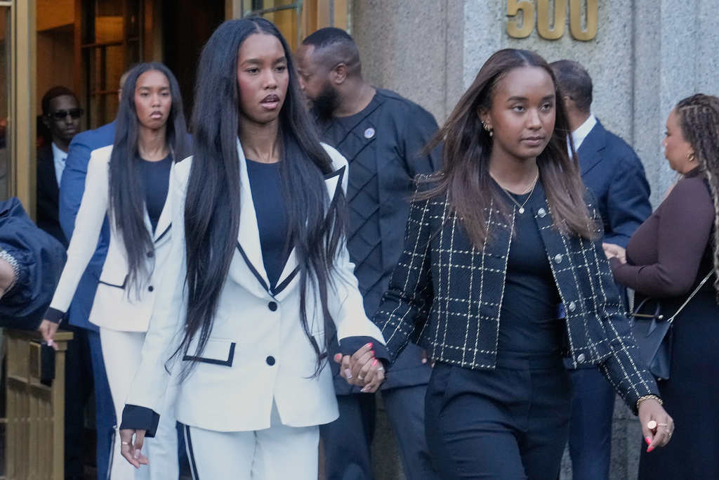 The twin daughters of Sean "Diddy" Combs, Chance Combs, right, and D'Lila Star Combs, leave Federal Court, in New York, Friday, Oct. 3, 2025. (AP Photo/Richard Drew)