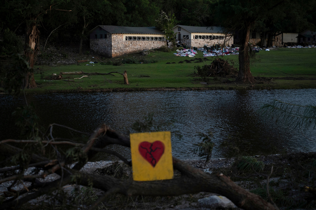 FILE - A broken heart sign is displayed near Camp Mystic on Tuesday, July 8, 2025, after a flash flood swept through the area in Hunt, Texas. (AP Photo/Eli Hartman, file)