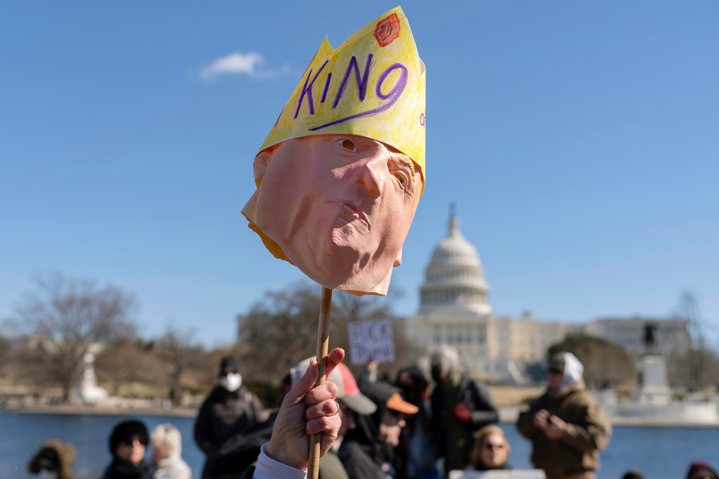 FILE - People take part in the "No Kings Day" protest on Presidents Day in Washington, Feb. 17, 2025, near the Capitol in Washington. (AP Photo/Jose Luis Magana, File)