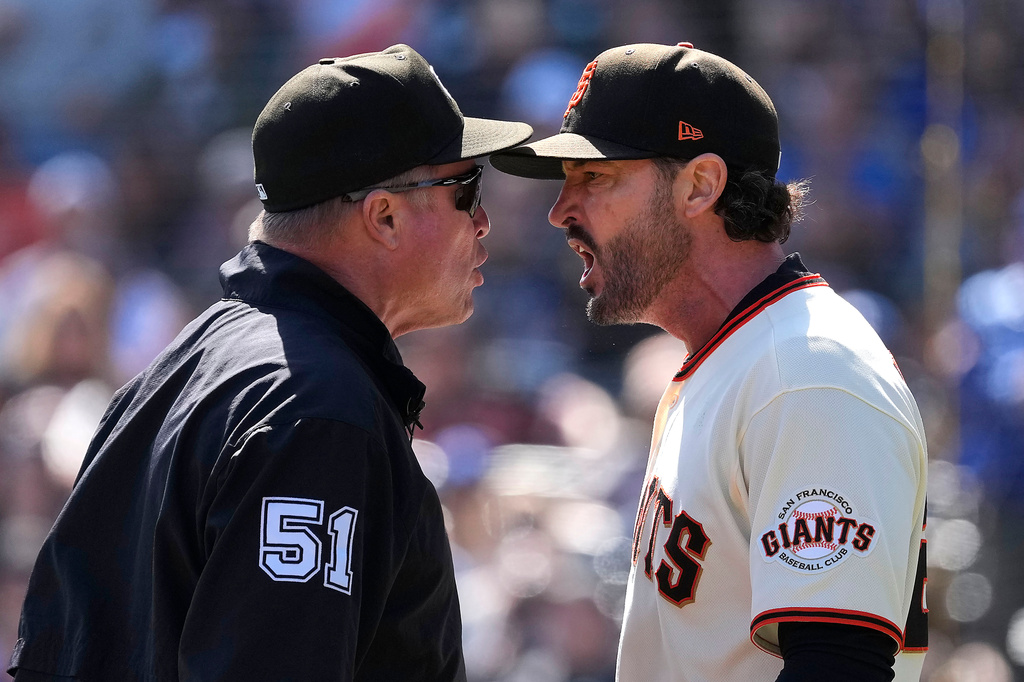 San Francisco Giants manager Tony Vitello, right, argues with umpire Marvin Hudson (51) as he is thrown out of the during the third inning of a baseball game against the Los Angeles Dodgers Sunday, Sept. 27, 2026, in San Francisco. (AP Photo/Tony Avelar)