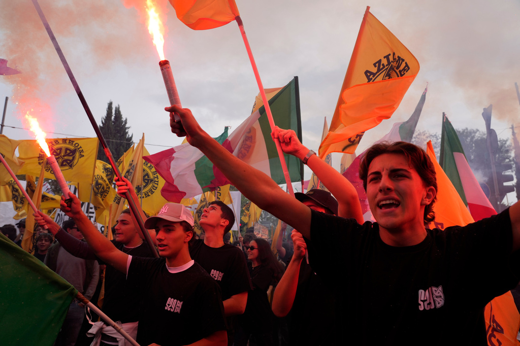 Members of right-wing student groups march through the streets of Rome, Saturday, Oct. 24, 2026, during a demonstration called "Unlock Everything," organized in opposition to recent left-wing student protests and one of several demonstrations held by groups across the political spectrum. (AP Photo/Gregorio Borgia)