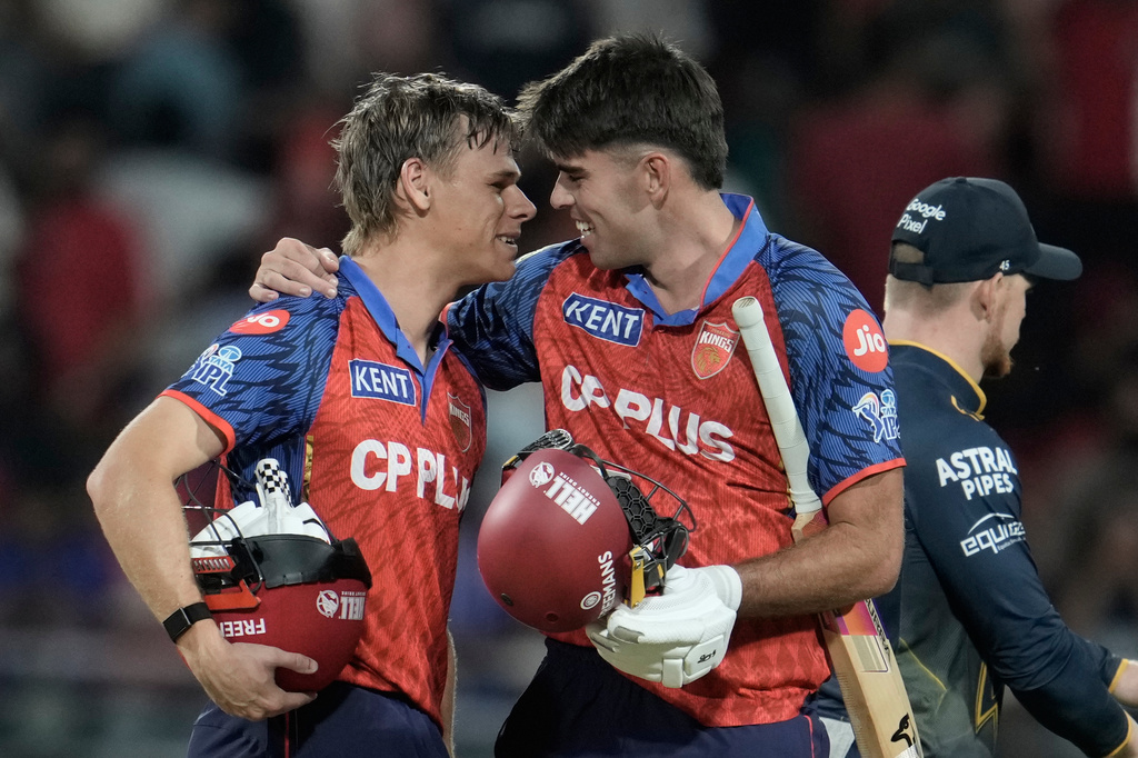 Punjab Kings' Cooper Connolly, left, and Xavier Bartlett celebrates the win against Gujarat Titans during the Indian Premier League cricket match in New Chandigarh, India, Tuesday, March 31, 2026. (AP Photo/Ashwini Bhatia)