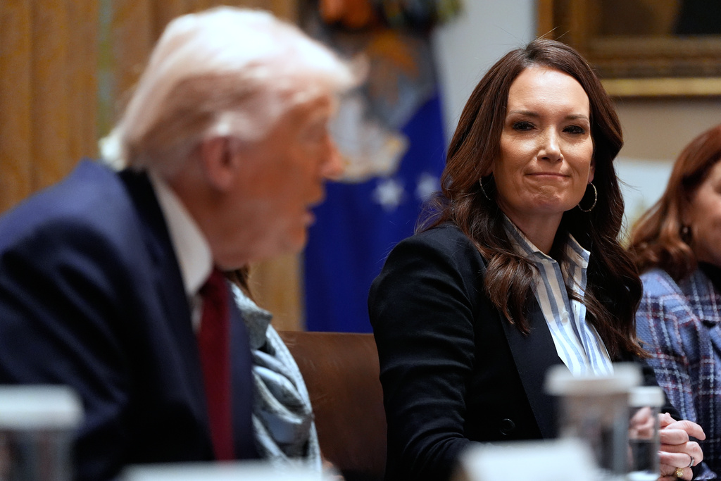 President Donald Trump speaks during a roundtable on farm subsidies in the Cabinet Room of the White House, Monday, Dec. 8, 2025, in Washington, as Agriculture Secretary Brooke Rollins listens. (AP Photo/Alex Brandon)