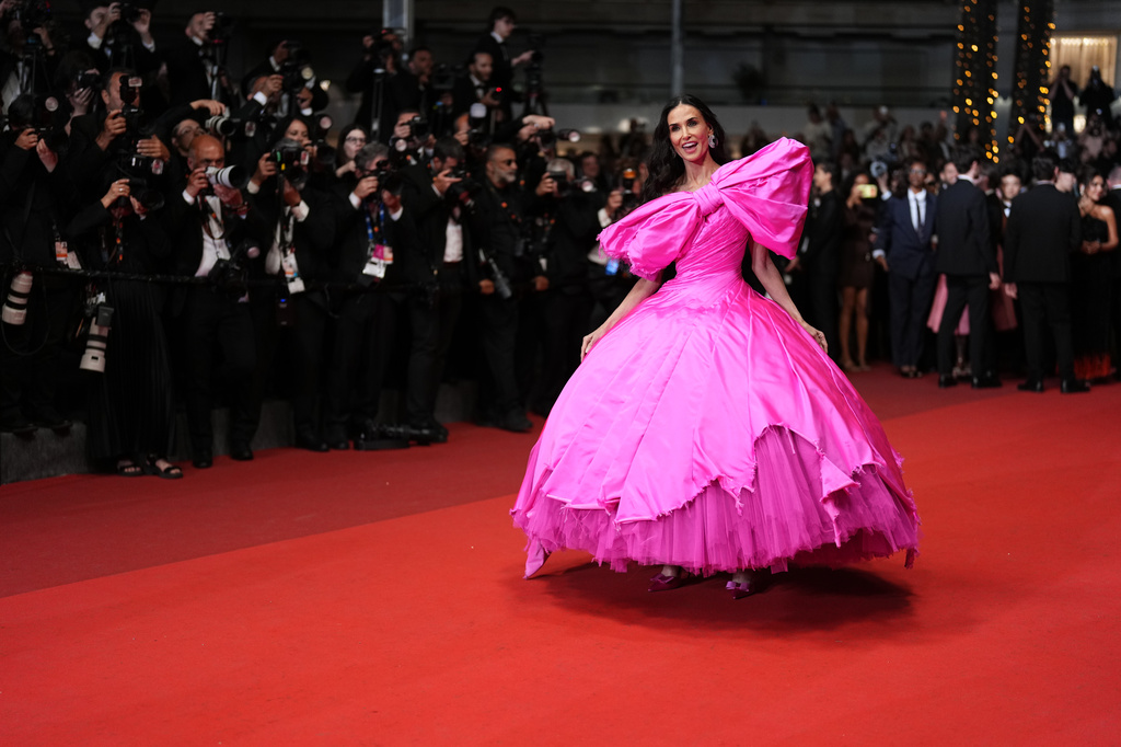 FILE - Jury member Demi Moore appears at the premiere of the film "Paper Tiger" at the 79th international film festival, Cannes, southern France, on May 16, 2026. (Photo by Scott A Garfitt/Invision/AP, File)