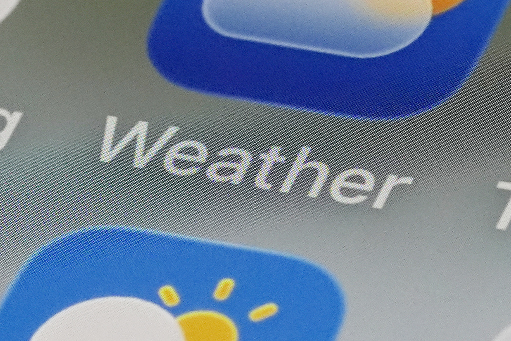 This photos shows weather apps arranged on a smartphone in Glenside, Pa., Thursday, Jan. 22, 2026. (AP Photo/Matt Rourke)