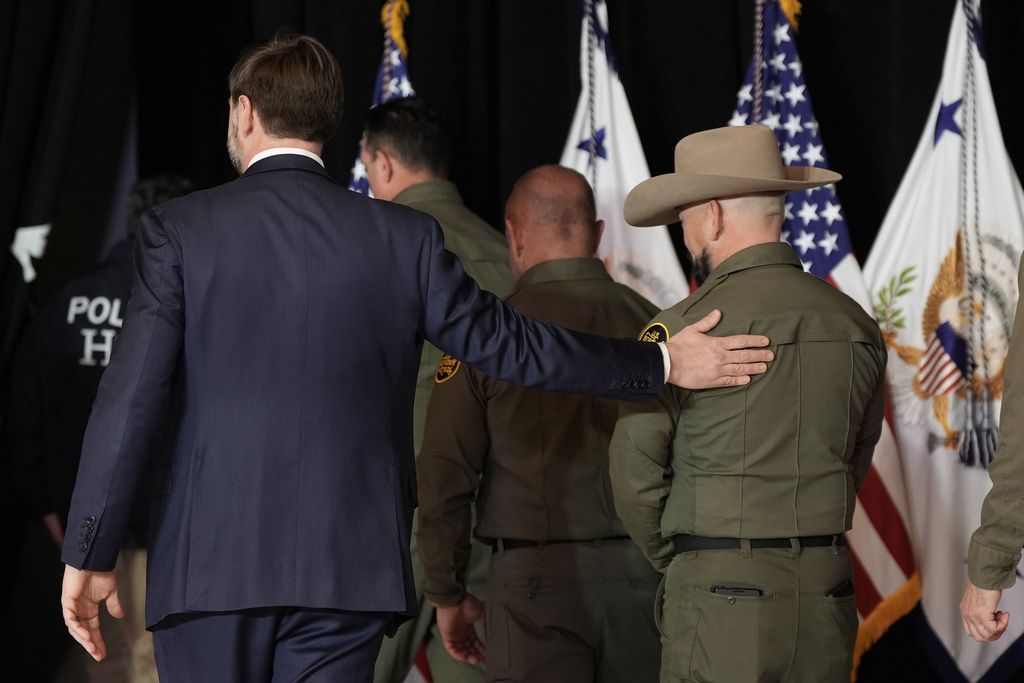 Vice President JD Vance walks out with Federal law enforcement agents after a news conference on Thursday, Jan. 22, 2026, in Minneapolis. (AP Photo/Angelina Katsanis)