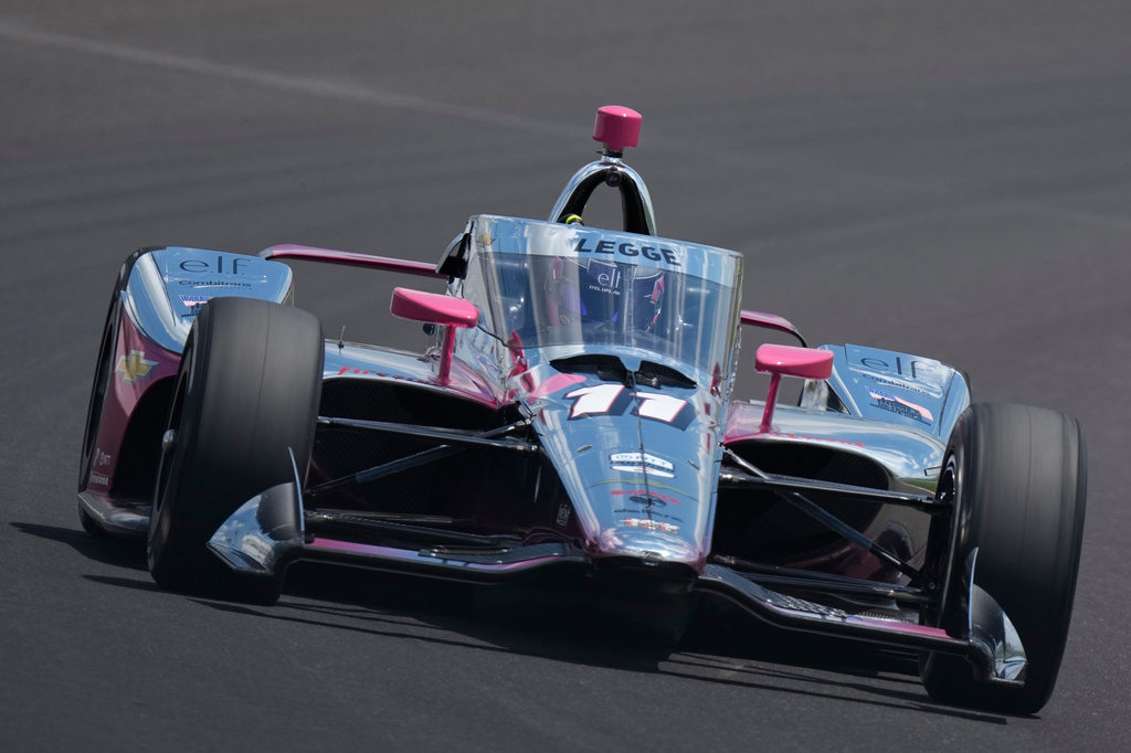 FILE - Katherine Legge, of Britain, drives through the third turn during qualifications for the Indianapolis 500 auto race at the Indianapolis Motor Speedway in Indianapolis, Sunday, May 17, 2026. (AP Photo/Michael Conroy, File)