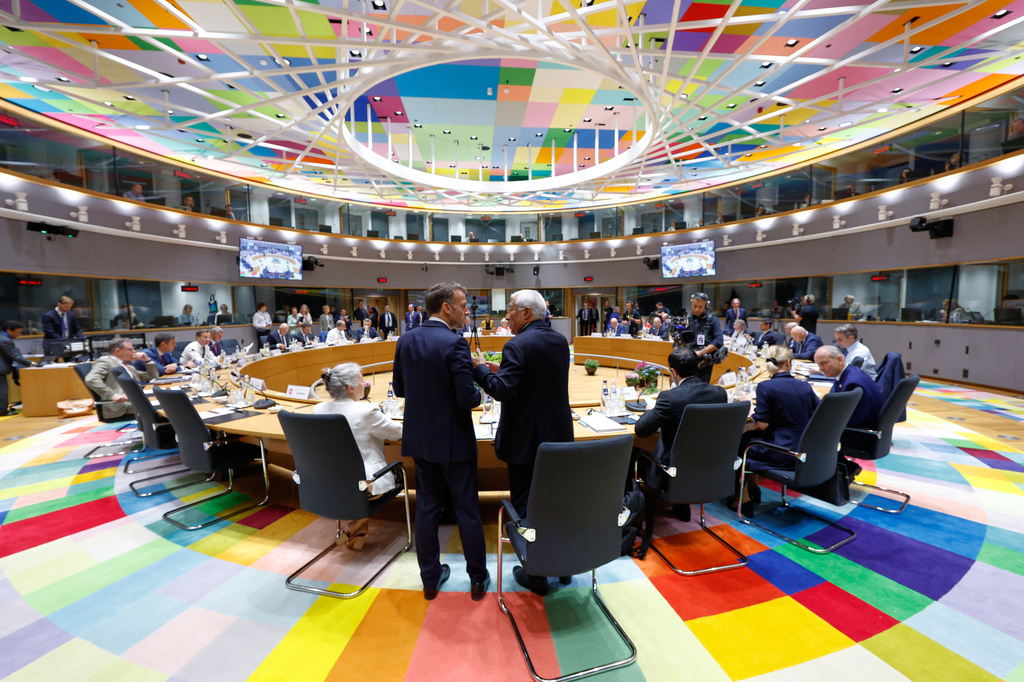 European Council President Antonio Costa, right, talks to French President Emmanuel Macron during a round table meeting at the EU summit in Brussels, Friday, June 19, 2026. (AP Photo/Geert Vanden Wijngaert)