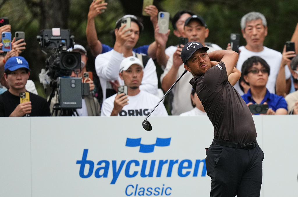 Xander Schauﬀele, of the U.S., tees off on the 18th hole during the final round of the Baycurrent Classic golf tournament at the Yokohama Country Club in Yokohama, near Tokyo, Sunday, Oct. 12, 2025. (AP Photo/Hiro Komae)