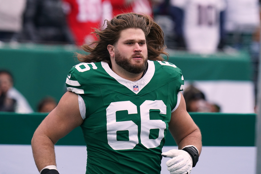 FILE - New York Jets guard Joe Tippmann (66) enters onto the field before an NFL football game against the New England Patriots, Dec. 28, 2025 in New York. (AP Photo/Vera Nieuwenhuis, File)