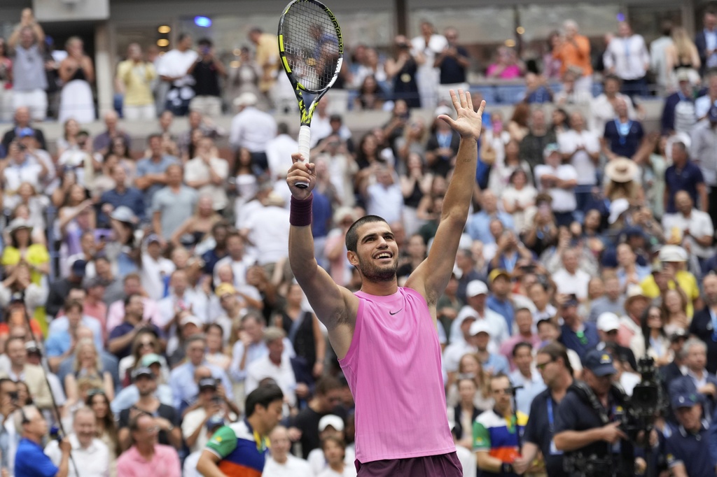 Carlos Alcaraz, of Spain, celebrates after defeating Novak Djokovic, of Serbia, during the men's singles semifinals of the U.S. Open tennis championships, Friday, Sept. 5, 2025, in New York. (AP Photo/Seth Wenig)