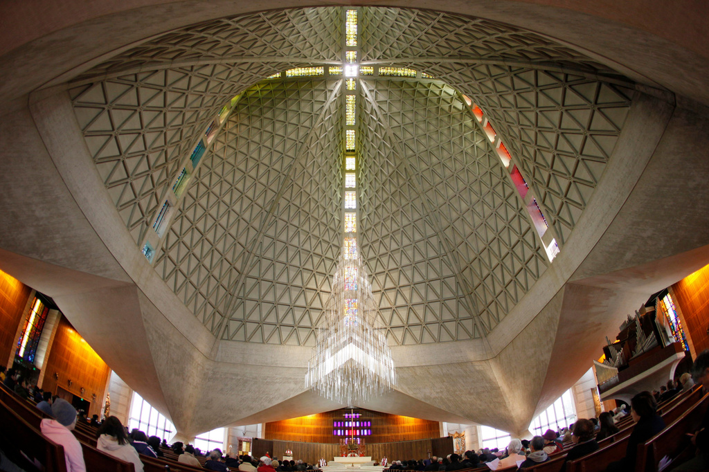 FILE - Parishioners attend a service at St. Mary's Cathedral, the mother church of the archdiocese in San Francisco, on April 2, 2010. (AP Photo/Eric Risberg, File)
