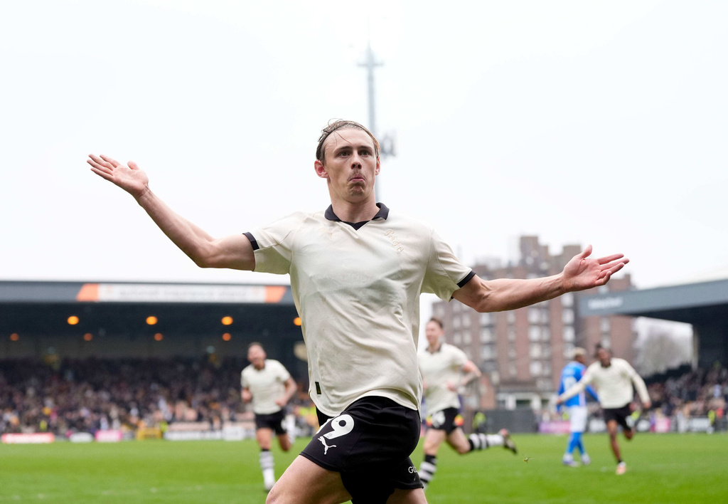 Port Vale's Ben Waine celebrates after scoring his side's first goal of the game during the FA Cup fifth round soccer match between Sunderland and Port Vale, in Stoke on Trent, England, Sunday March 8, 2026. (Nick Potts/PA via AP)