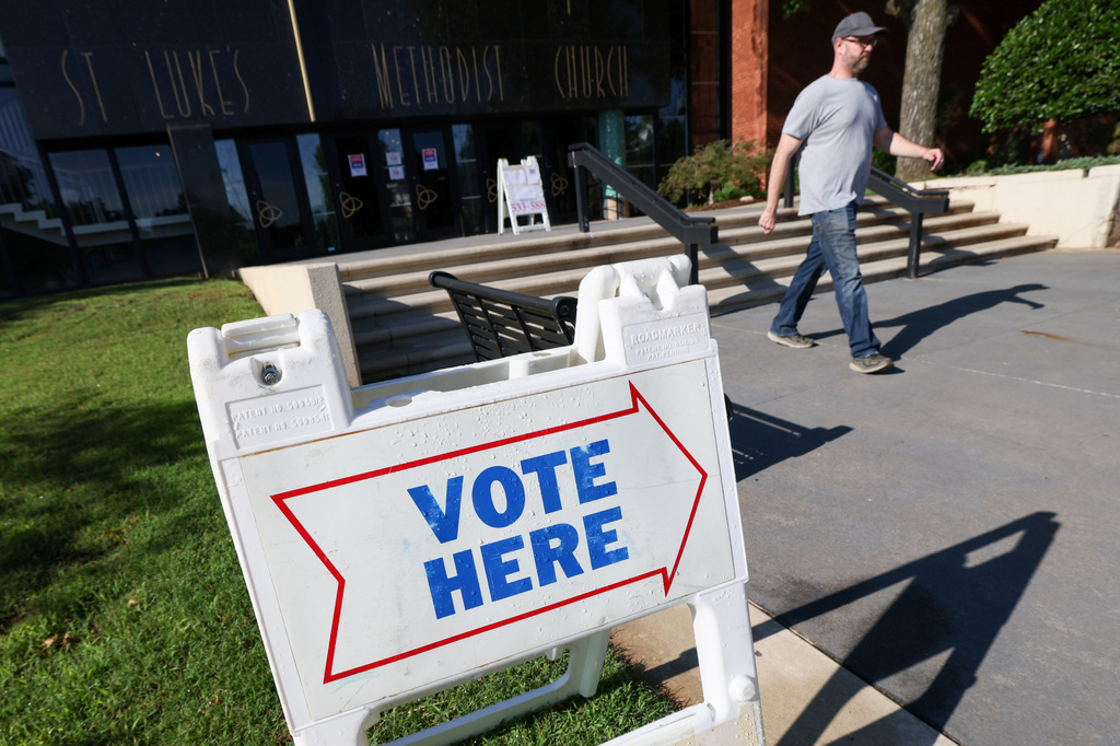 A voter leaves a polling location at St. Luke's Methodist Church, Tuesday, June 16, 2026, in Oklahoma City. (AP Photo/Nate Billings)
