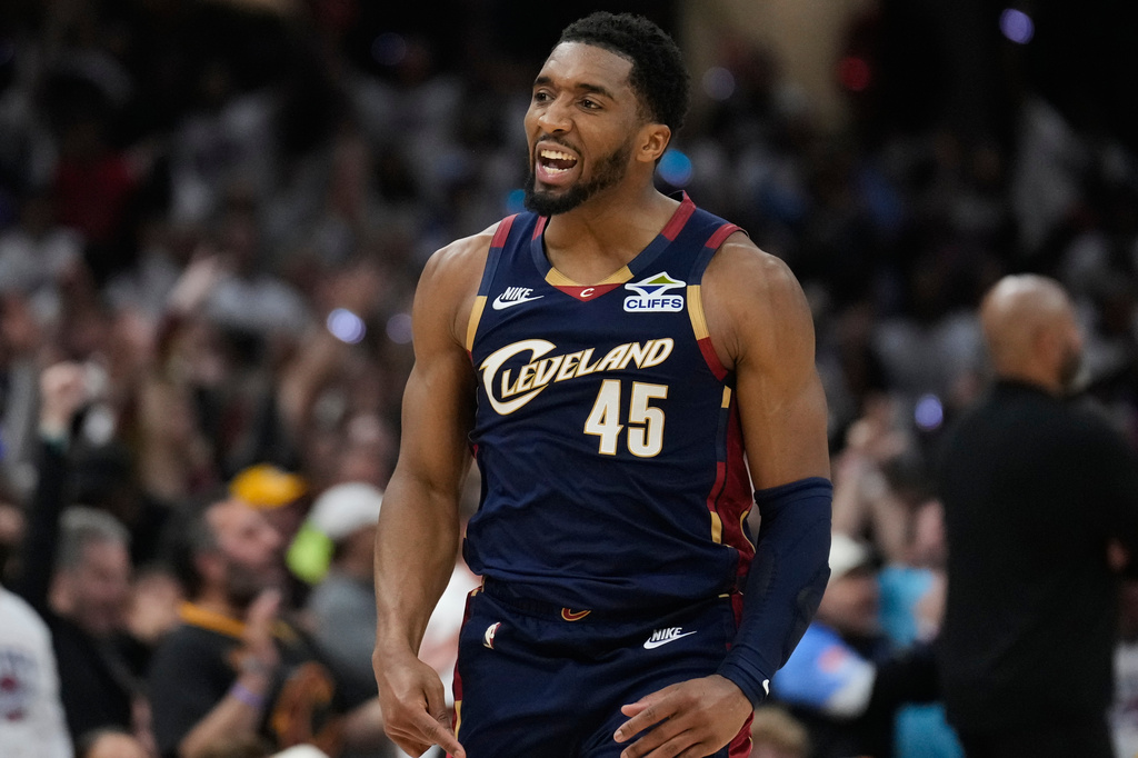 FILE - Cleveland Cavaliers' Donovan Mitchell (45) gestures after hitting a three-point basket inthe second half of Game 4 of a second-round NBA basketball playoff series against the Detroit Pistons, May 11, 2026, in Cleveland. (AP Photo/Sue Ogrocki, File)