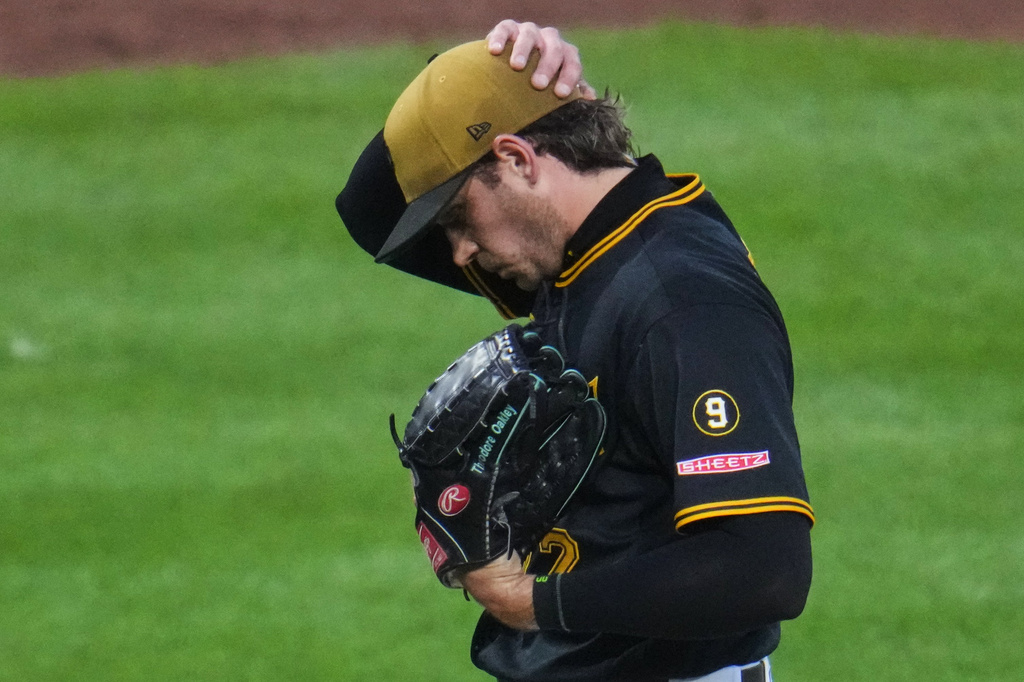 Pittsburgh Pirates pitcher Isaac Mattson walks off the mound after handing the ball to manager Don Kelly during the sixth inning of a baseball game against the Chicago Cubs in Pittsburgh, Saturday, July 25, 2026. (AP Photo/Gene J. Puskar)