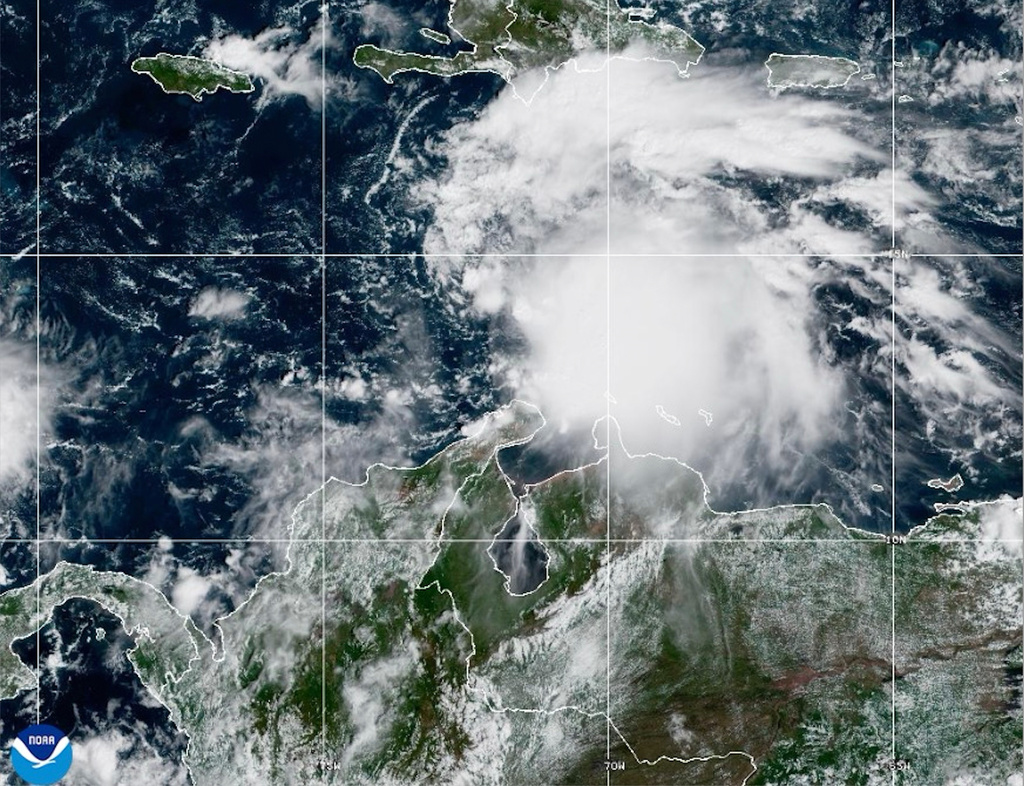 This NOAA satellite image taken at 11:40 a.m. EST on Tuesday, Oct. 21, 2025, shows Tropical Storm Melissa in the Central Caribbean Sea. (NOAA via AP)