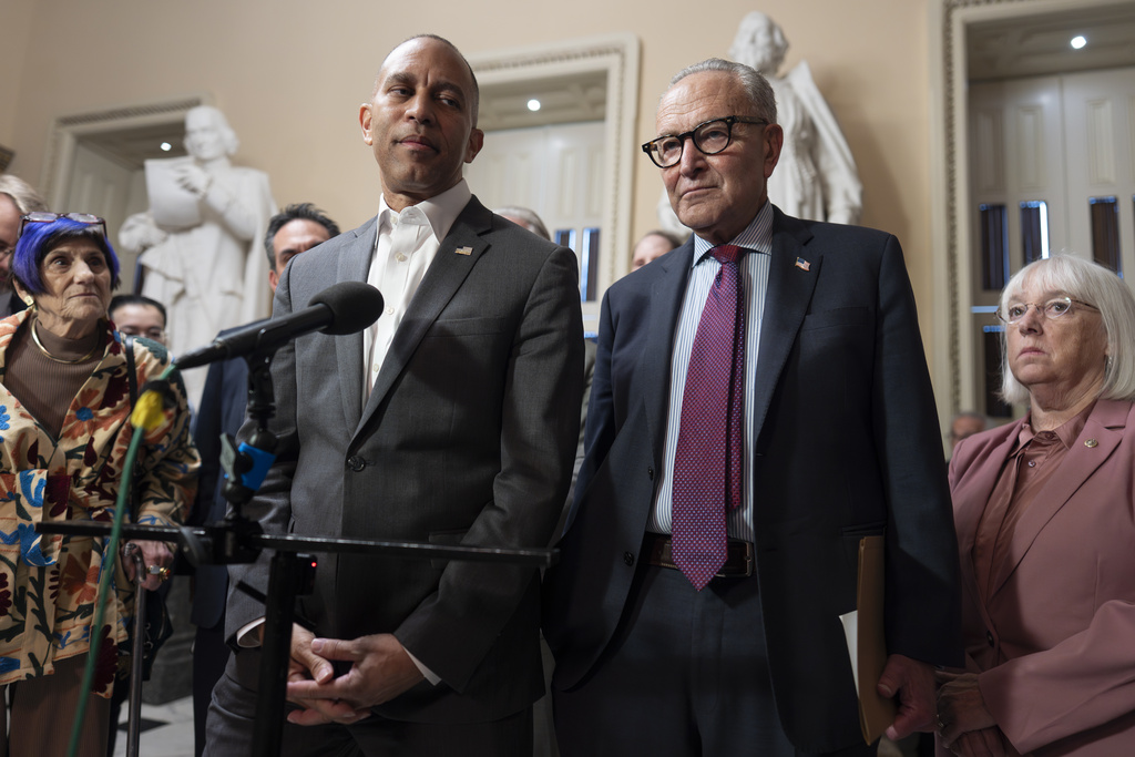 House Democratic Leader Hakeem Jeffries, left, and Senate Democratic Leader Chuck Schumer, both of New York, tell reporters that they are united as the Sept. 30 funding deadline approaches, at the Capitol in Washington, Thursday, Sept. 11, 2025. (AP Photo/J. Scott Applewhite)