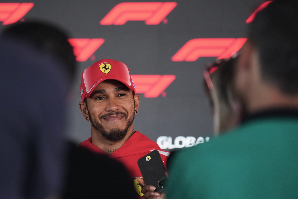 Ferrari driver Lewis Hamilton, of Britain, talks to the media ahead of Sunday's Formula One Hungarian Grand Prix auto race, at the Hungaroring race track in Mogyorod, near Budapest, Hungary, Thursday, July 23, 2026. (AP Photo/Darko Vojinovic)