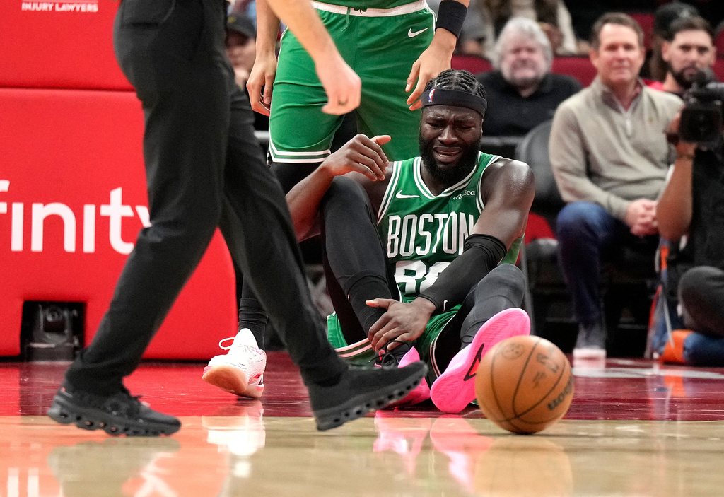 Boston Celtics center Neemias Queta (88) on the court after a collision with Houston Rockets' Jae'sean Tate during the first half of an NBA basketball game, in Houston, Wednesday, Feb. 4, 2026. (AP Photo/ Karen Warren)