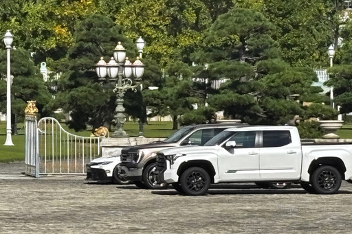 CORRECTS DATE AND LOCATION - A Ford F-150, center, and two other American-made cars sit parked outside the Akasaka Palace, Japan's guest house for visiting foreign leaders, in Tokyo, Japan, Tuesday, Oct. 28, 2025, as President Donald Trump meets Japan's Prime Minister Sanae Takaichi. (AP Photo/Mayuko Ono) CORRECTS DATE AND LOCATION - A Ford F-150, center, and two other American-made cars sit parked outside the Akasaka Palace, Japan's guest house for visiting foreign leaders, in Tokyo, Japan, Tuesday, Oct. 28, 2025, as President Donald Trump meets Japan's Prime Minister Sanae Takaichi. (AP Photo/Mayuko Ono)