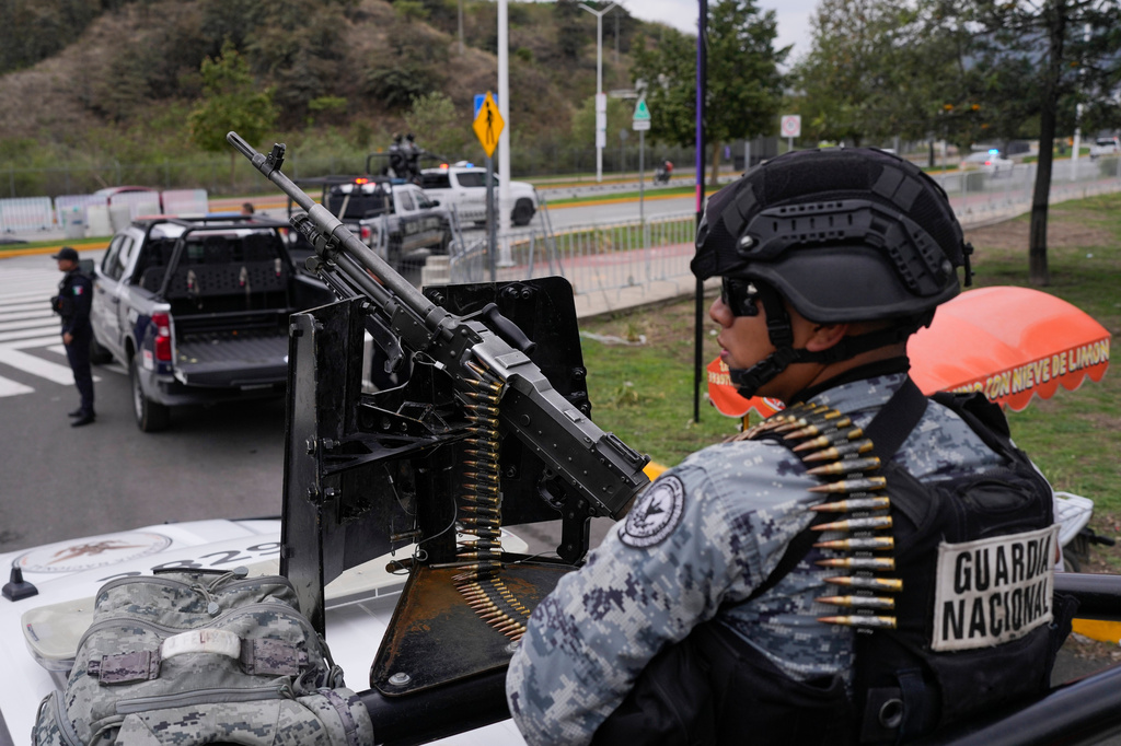 National Guard stand on guard outside the stadium that will host FIFA World Cup matches in Guadalajara, Mexico, Tuesday, June 9, 2026. (AP Photo/Matias Delacroix)