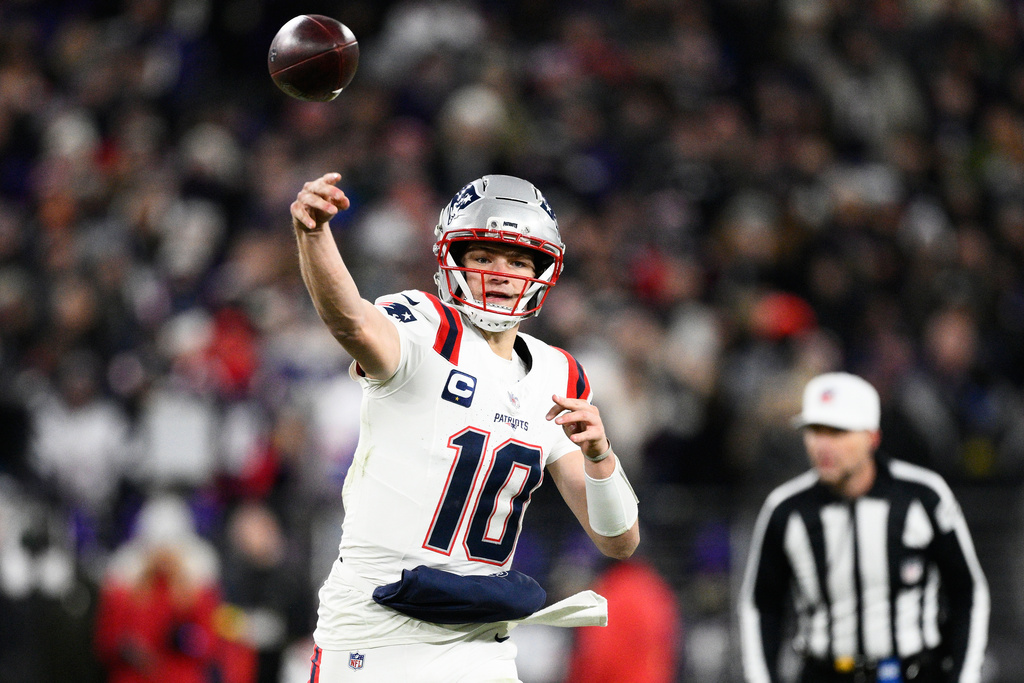 New England Patriots quarterback Drake Maye (10) passes against the Baltimore Ravens during the first half of an NFL football game, Sunday, Dec. 21, 2025, in Baltimore. (AP Photo/Nick Wass)