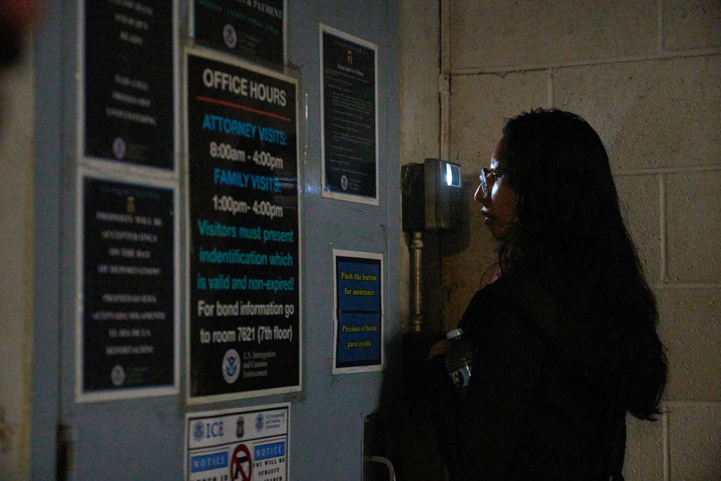 FILE - Sociology college graduate Olivia Cortez faces a video interphone as she inquires for her father, Oliverio Cortez, an immigrant arrested by ICE at a car wash in Glendale, Calif., outside the ICE Los Angeles Staging Facility in Los Angeles, on Wednesday, June 25, 2025. (AP Photo/Damian Dovarganes, File)