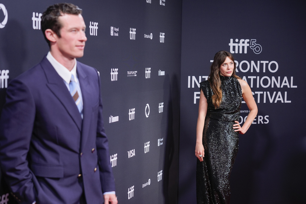 Callum Turner, left, and Elizabeth Olsen attend the premiere of "Eternity" during the Toronto International Film Festival on Sunday, Sept. 7, 2025, at Roy Thomson Hall in Toronto. (AP Photo/Chris Pizzello)