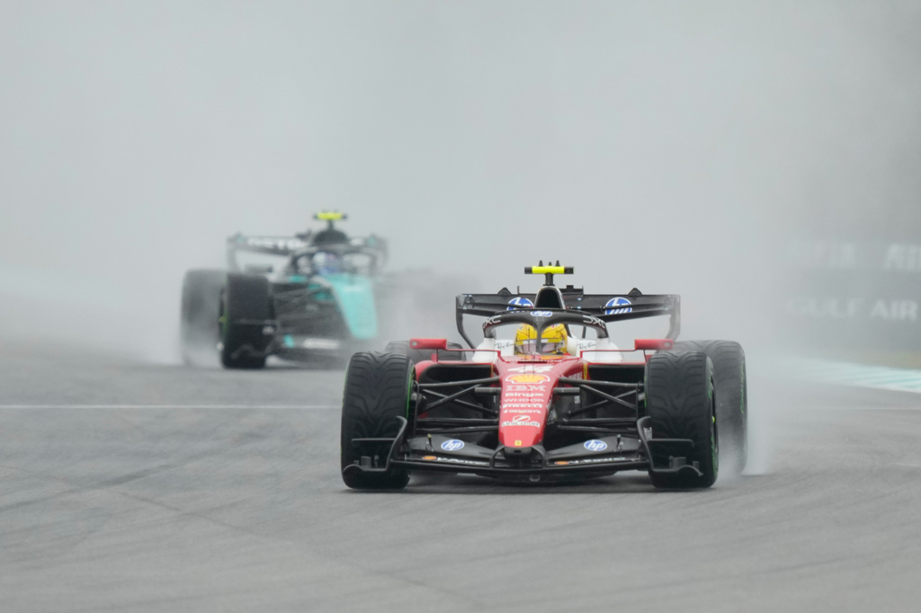 Ferrari driver Lewis Hamilton of Britain steers his car during the formation lap prior to the delayed start of the Bahrain Grand Prix in Sepang, Malaysia, Sunday, Oct. 4, 2026. (AP Photo/Aijaz Rahi)