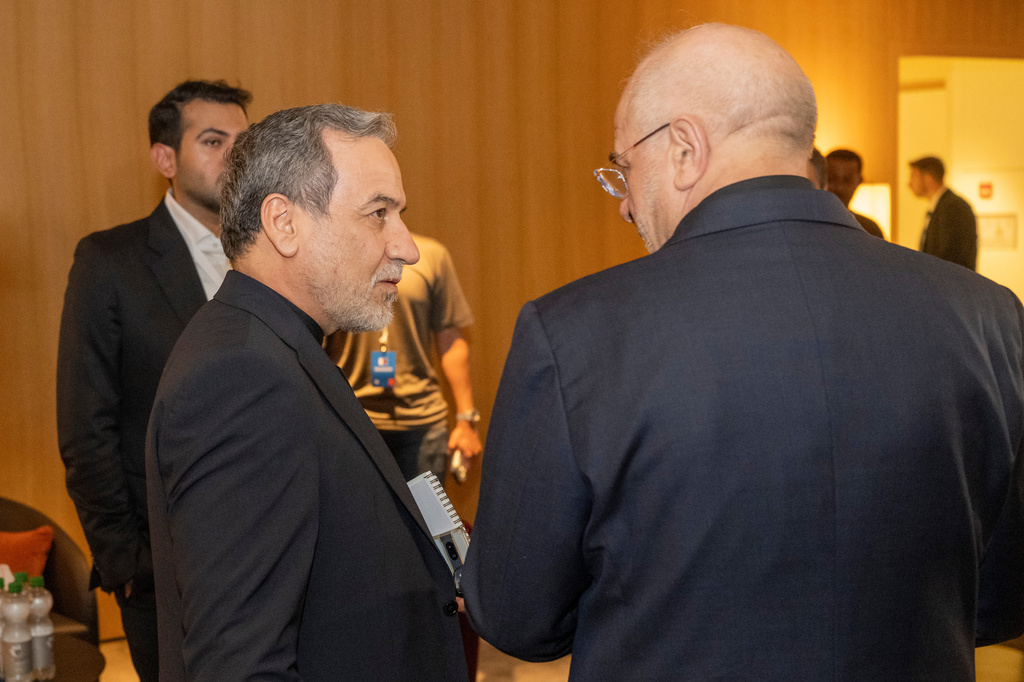 Iranian Foreign Minister Seyyed Abbas Araghchi, left, and Speaker of the Islamic Parliament of Iran Mohammed Bagher Ghalibaf, right, confer at the Buergenstock resort in Obbuergen, near Lucerne, Switzerland, early Sunday, June 21, 2026. (Urs Flueeler/Keystone, Pool via AP)