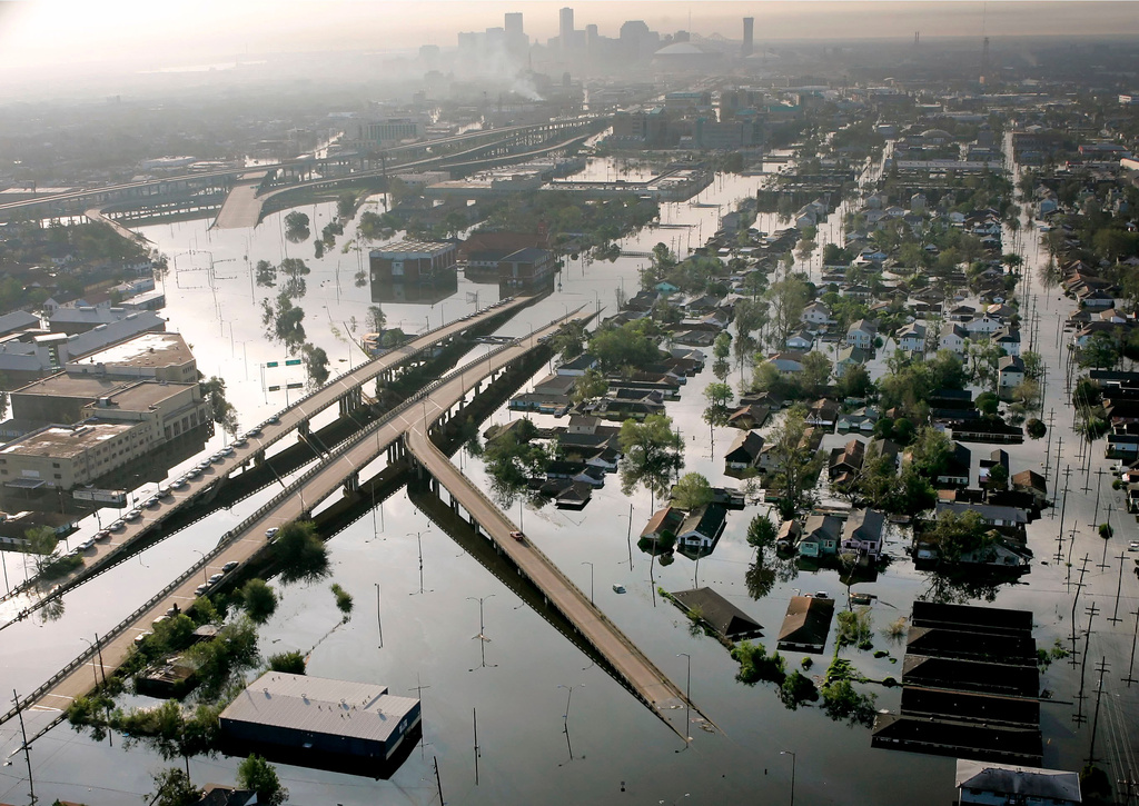 FILE - Floodwaters from Hurricane Katrina fill the streets near downtown New Orleans on Aug. 30, 2005. (AP Photo/David J. Phillip, File)