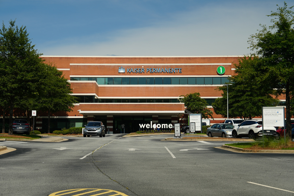 Signs mark the exterior of Kaiser Permanente medical center in Jonesboro, Ga., Thursday, Aug. 6, 2026. (AP Photo/Emilie Megnien)