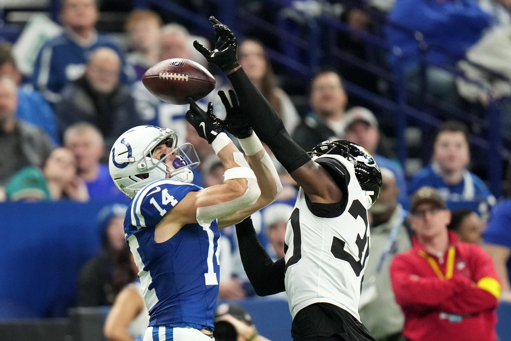 Jacksonville Jaguars cornerback Montaric Brown, right, breaks up a pass intended for Indianapolis Colts wide receiver Alec Pierce (14) during the second half of an NFL football game Sunday, Dec. 28, 2025, in Indianapolis. (AP Photo/AJ Mast)