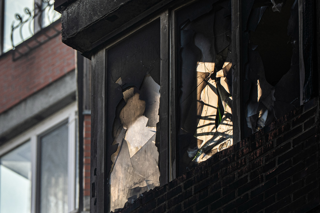 An apartment building damaged in Russian attacks, Wednesday, Oct. 22, 2025, in Kyiv, Ukraine. (AP Photo/Julia Demaree Nikhinson)