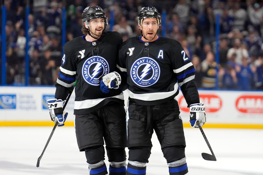 Tampa Bay Lightning defenseman Ryan McDonagh, right, celebrates his goal against the New Jersey Devils with defenseman Max Crozier during the second period of an NHL hockey game Saturday, Oct. 11, 2025, in Tampa, Fla. (AP Photo/Chris O'Meara)