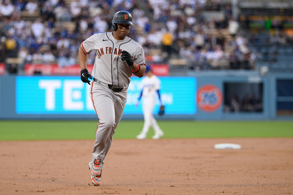 San Francisco Giants' Rafael Devers rounds the bases after hitting a solo home run during the second inning of a baseball game against the Los Angeles Dodgers in Los Angeles, Monday, May 11, 2026. (AP Photo/Kyusung Gong)